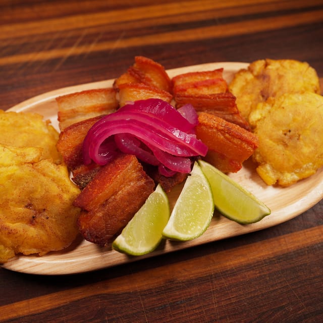 Pork Chunks with Fried Green Plantains.